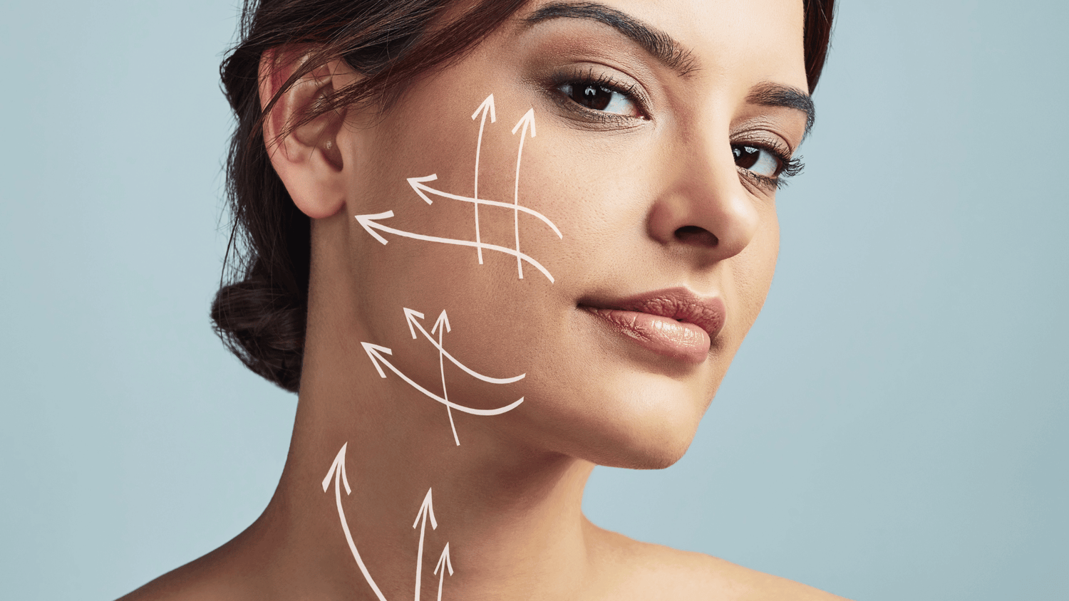 Facelift at 40; a women with drawn treatment lines for her procedure