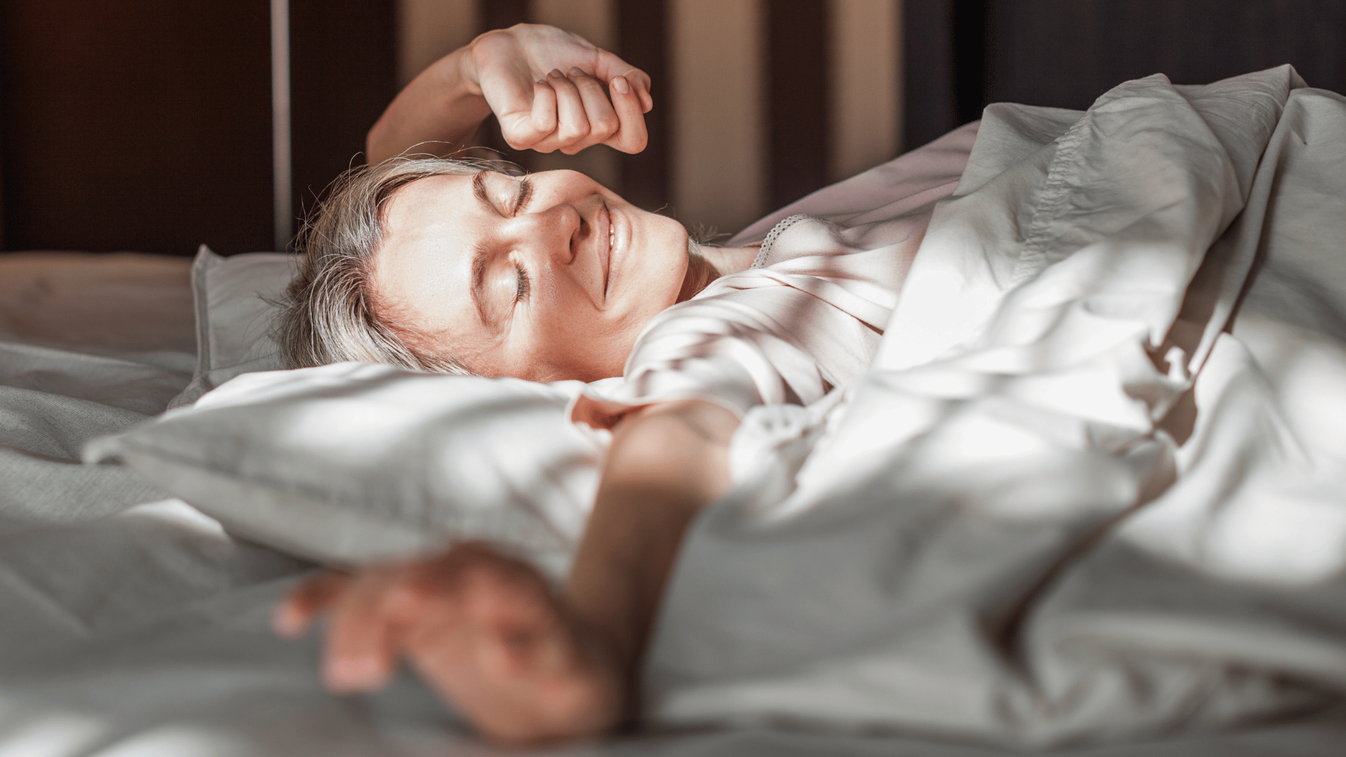 Woman waking up with a glow, skin looking youthful