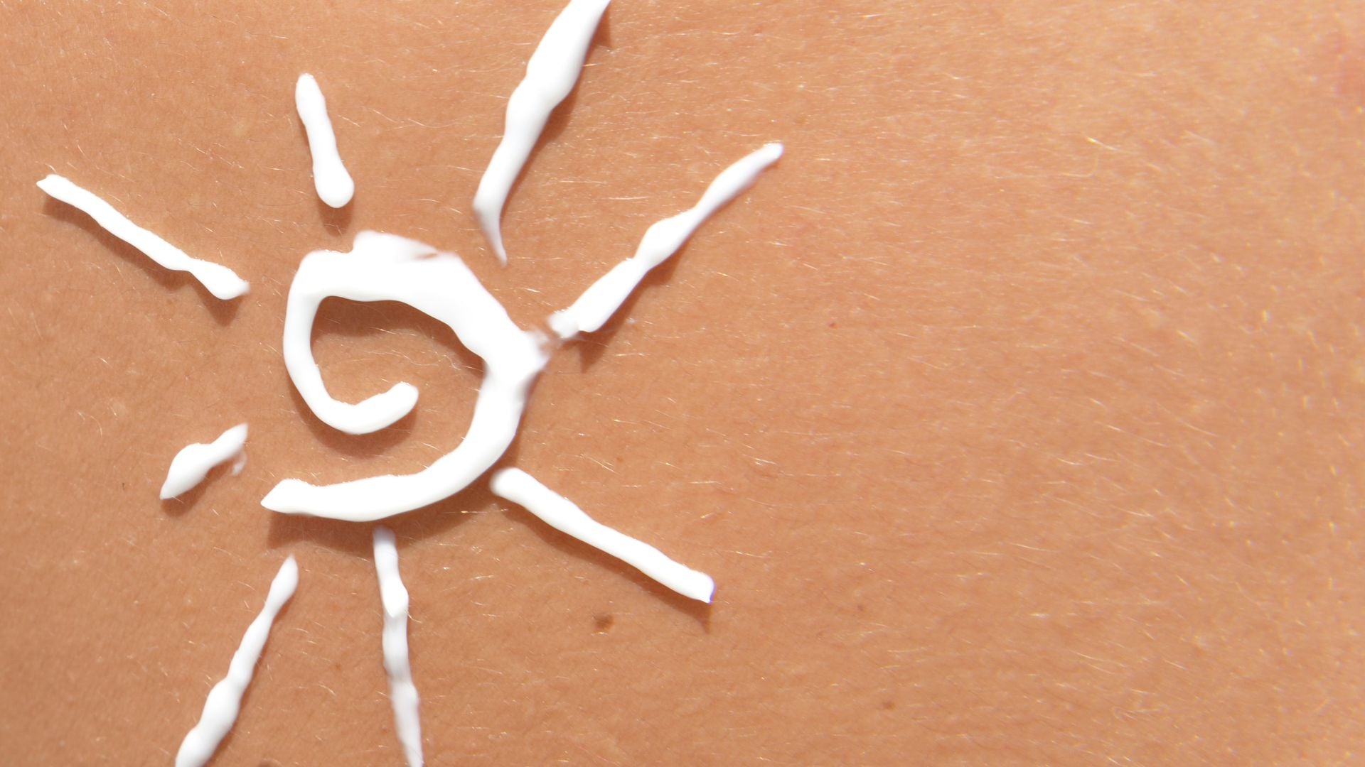 Skincare applied to the skin in the shape of a sun