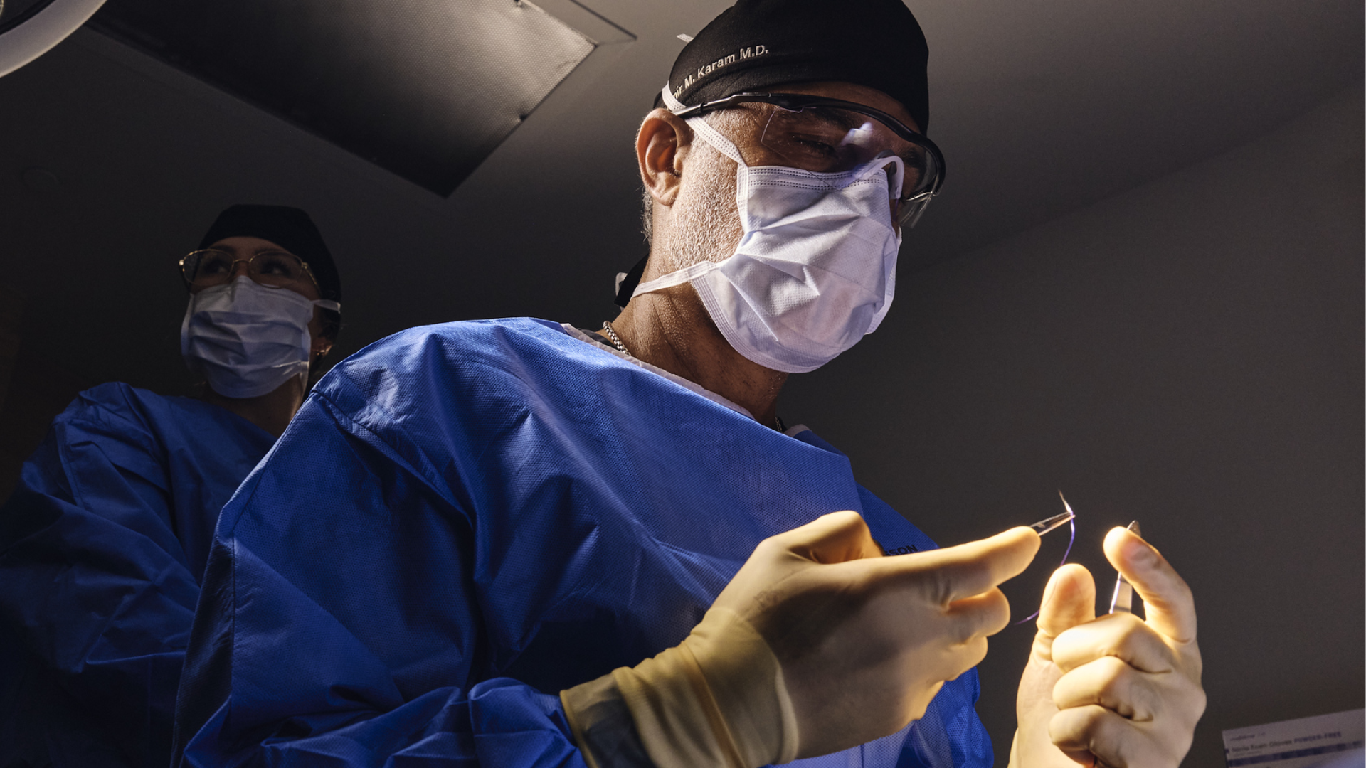 See Dr. Karam performing a precise surgical procedure, combining advanced technique, focused care, and years of facial rejuvenation expertise.