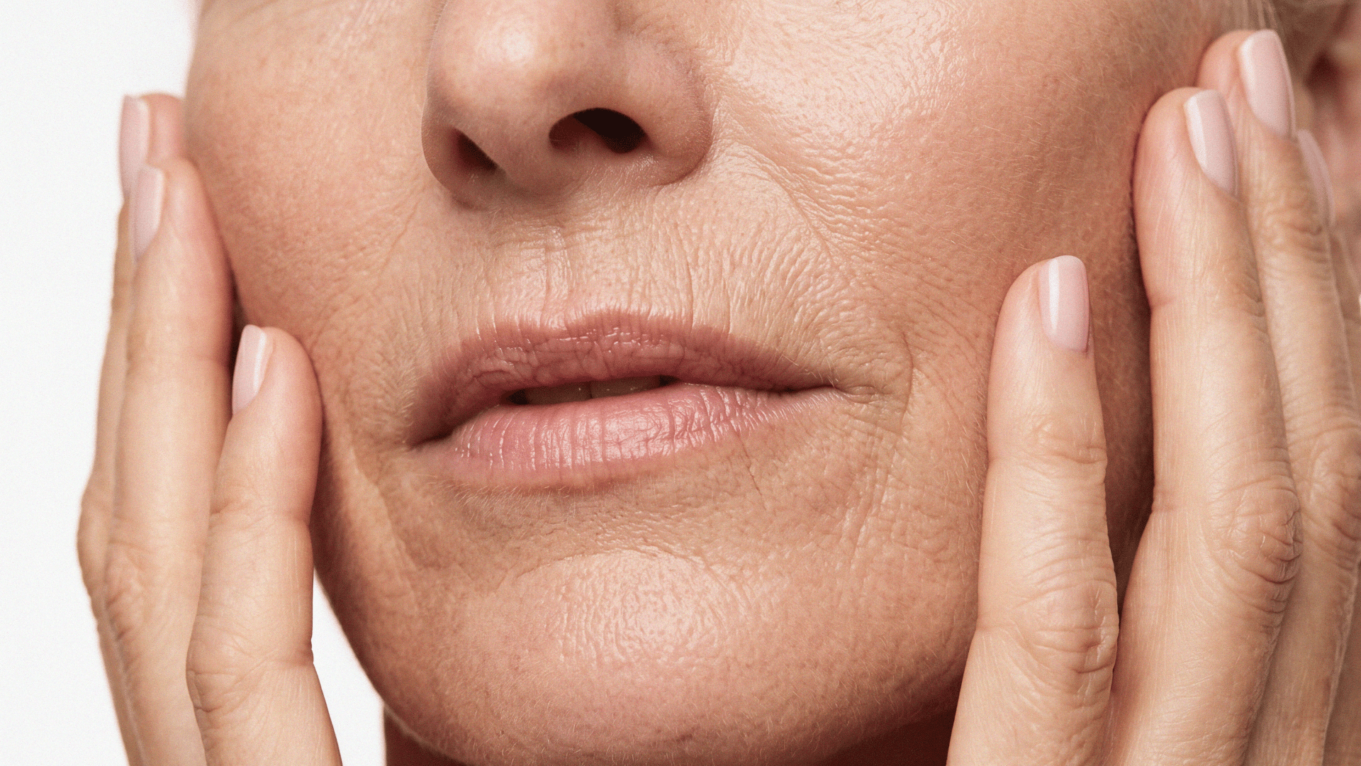 A close-up of mature skin showing fine lines and texture, highlighting visible signs of aging.