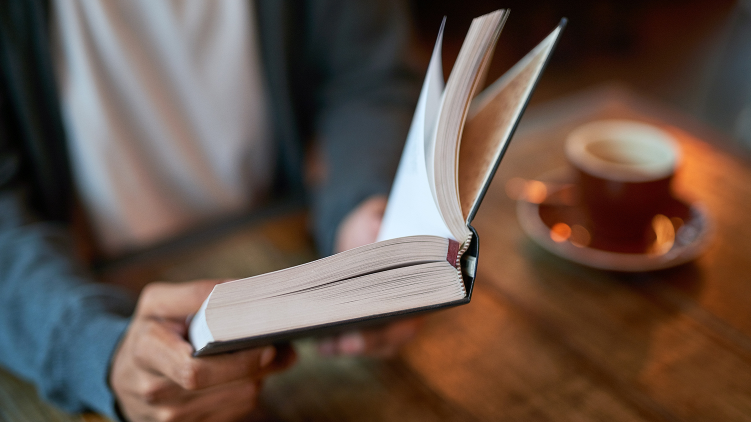 Man reading a book for a healthier, stress-free mind