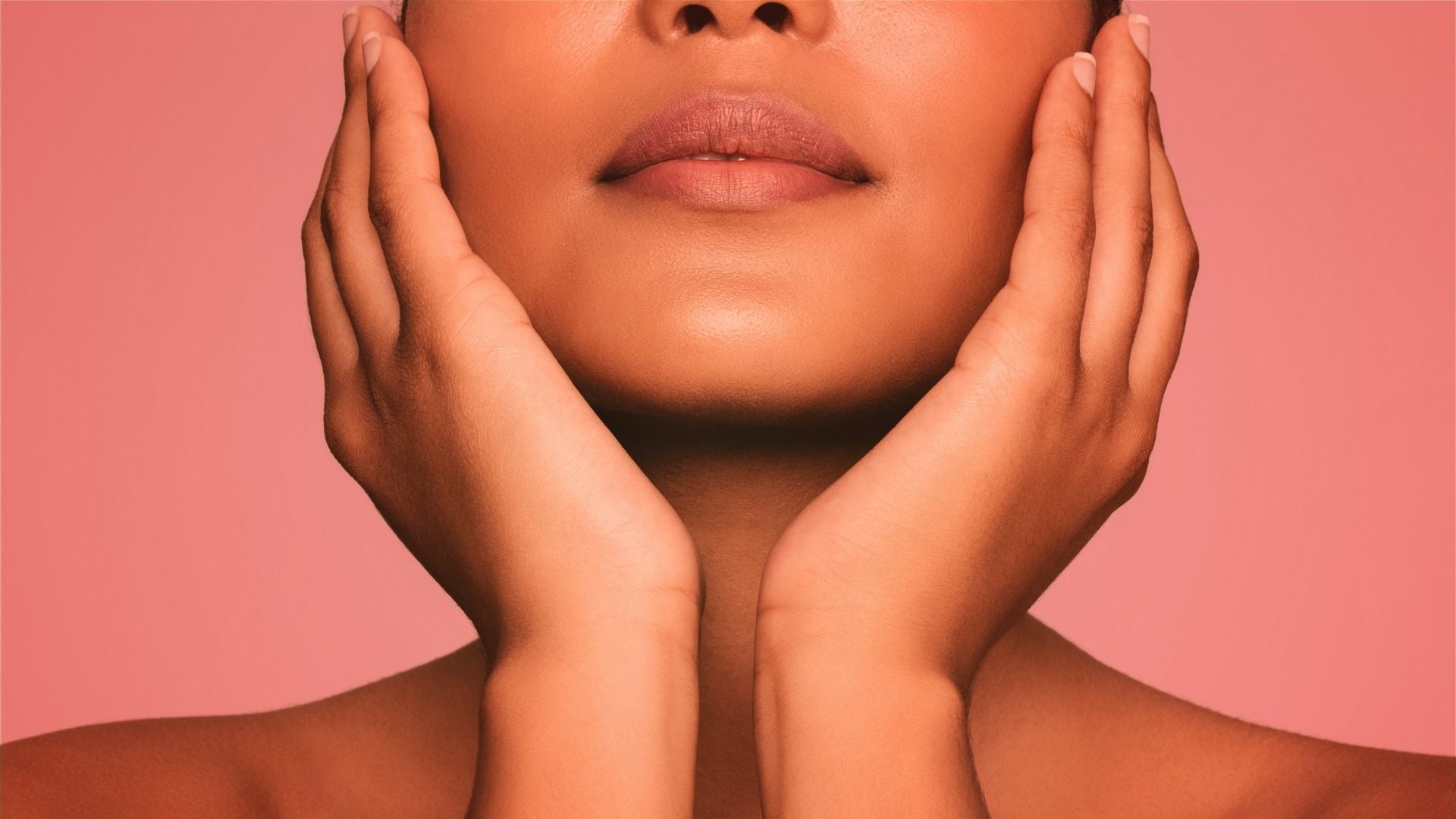 a woman with glowing skin in red light therapy