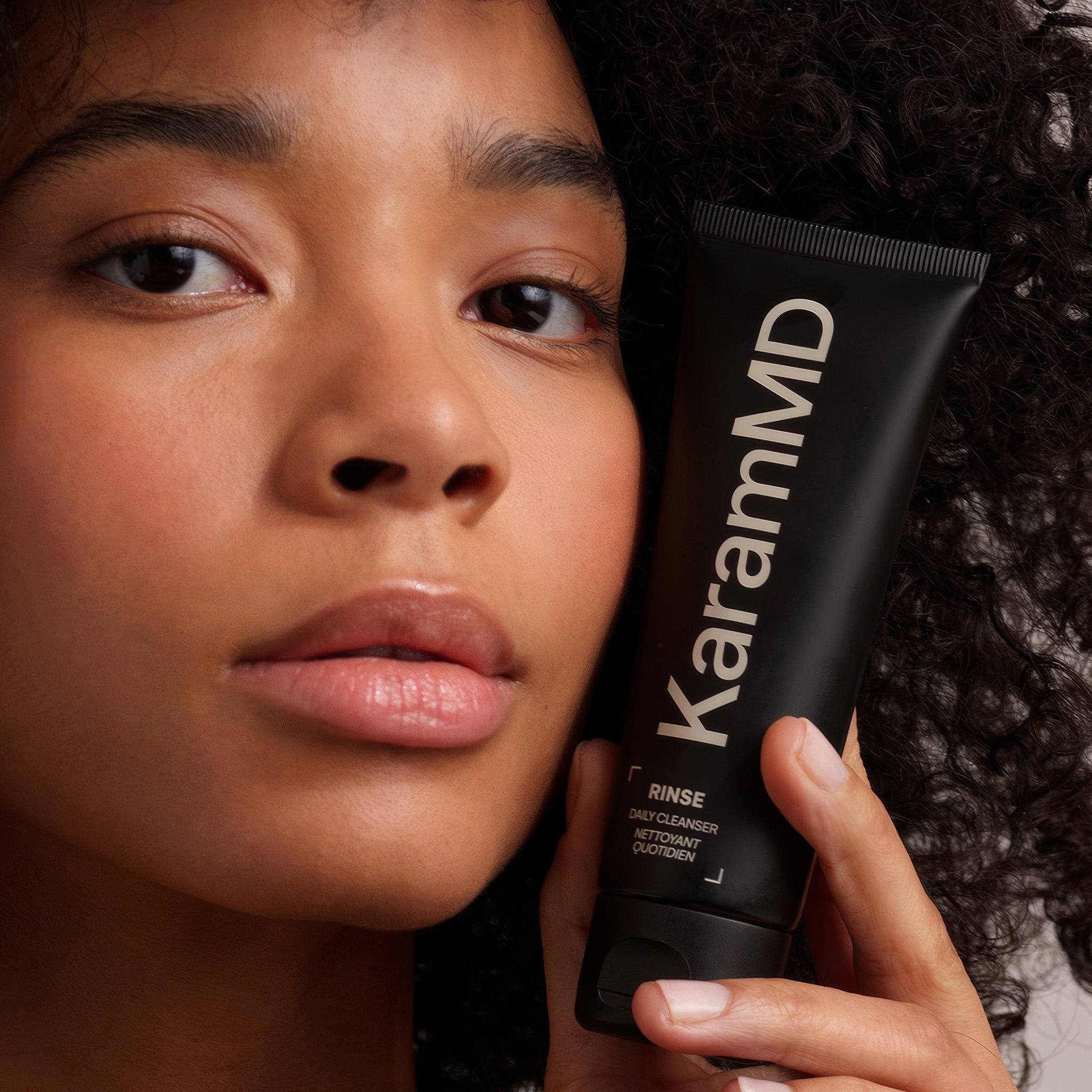 Alternate carousel view of Rinse bottle emphasizing its dermatologist-developed formulation and suitability for all skin types.