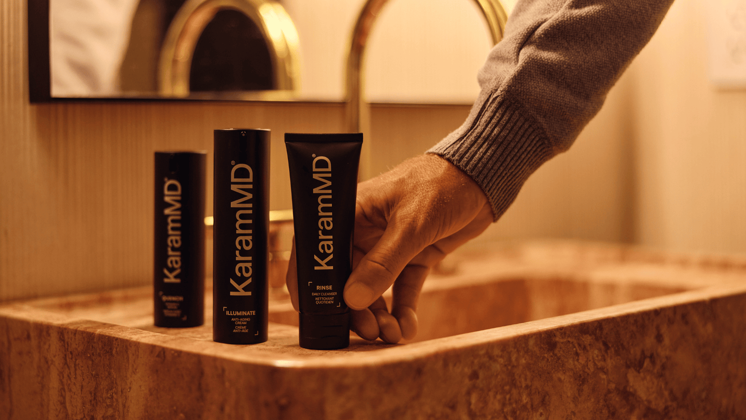 Dr. Karam placing Rinse, Illuminate, and Quench on a counter