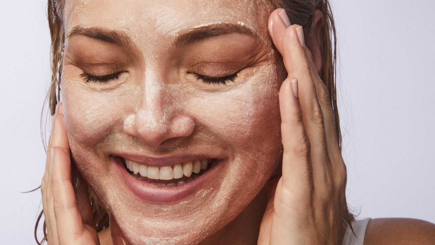 woman using KaramMD Polish Ezymatic Exfoliator