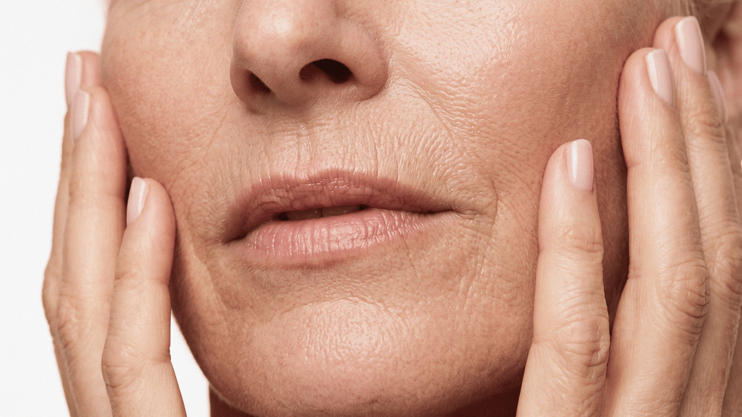 A close-up of mature skin showing fine lines and texture, highlighting visible signs of aging.