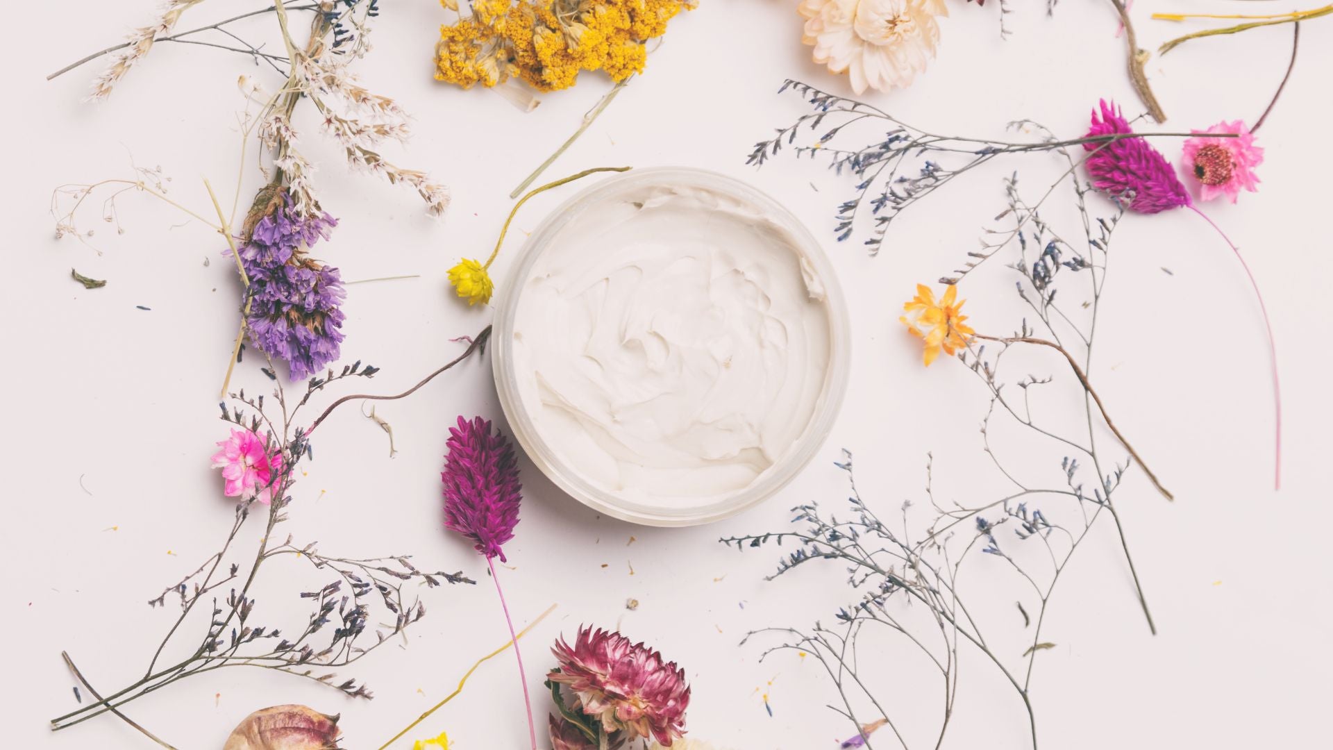 eye cream surrounded by natural elements