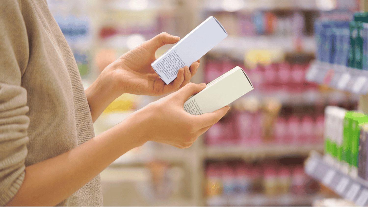 skincare shopper looking at labels on the the boxes while shopping in a beauty aisle