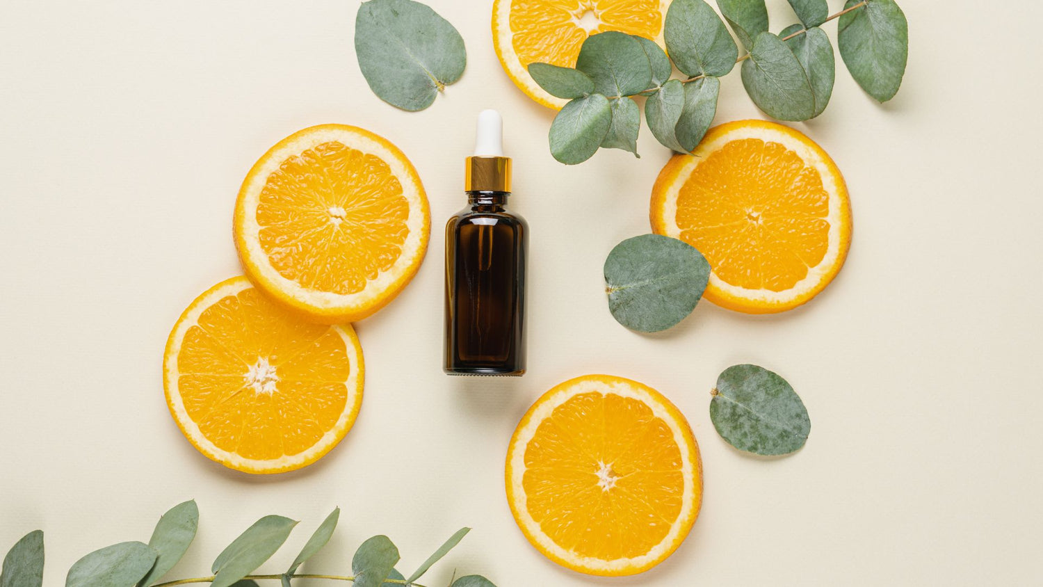3 collagen boosting skincare ingredients on a background of citrus representing vitamin c