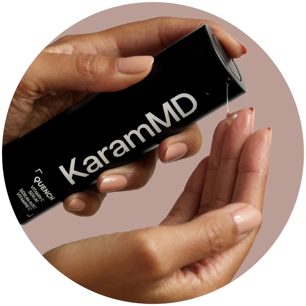 Hand applying KaramMD Quench on a fingertip against a pink background
