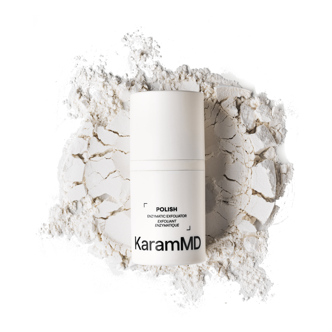 Lifestyle image of Polish Enzymatic Exfoliator featured on a countertop with complementary products, reinforcing its role in the full KaramMD skincare regimen.