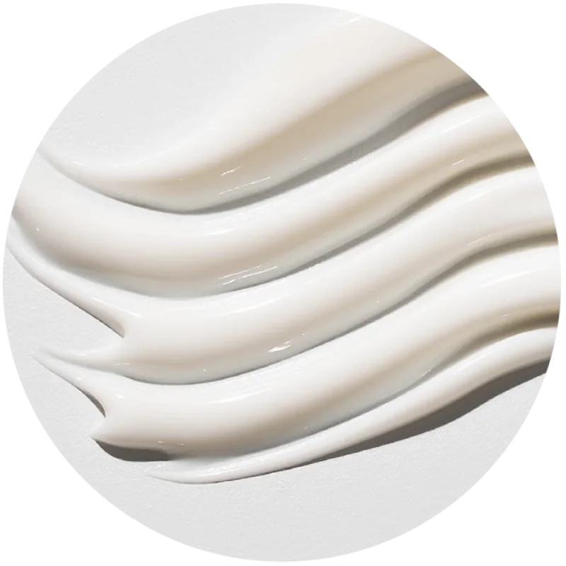 A close-up on a wave of cream applied to a white wall